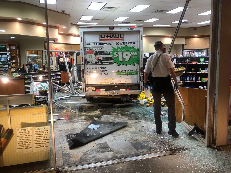 Driver crashes into convenience store with U-Haul, one injured