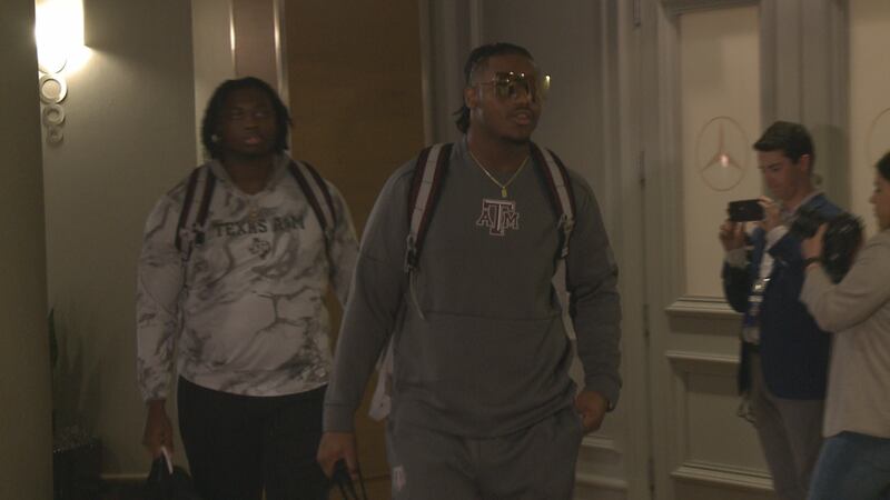 Texas A&M Football players DeMarvin Leal and Kenyon Green walk into the Wynfrey Hotel in...