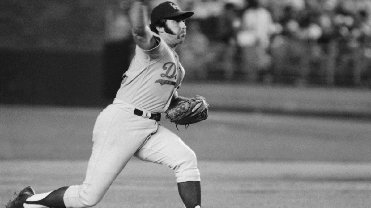 In this August 1974 file photo, Los Angeles Dodgers pitcher Mike Marshall throws to a New York...