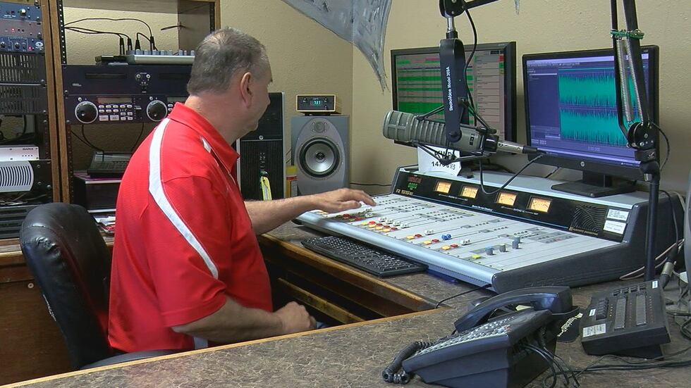 Radio host Mark McLain can be seen in the KWRD Radio studio.