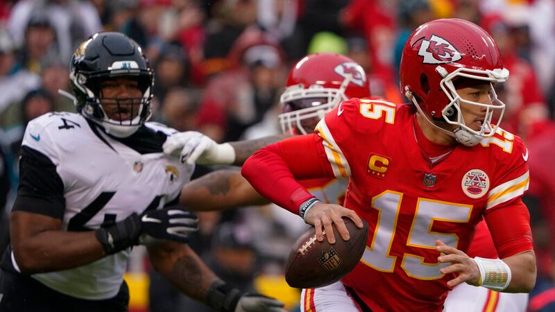 Kansas City Chiefs quarterback Patrick Mahomes (15) runs out of the pocket against the...
