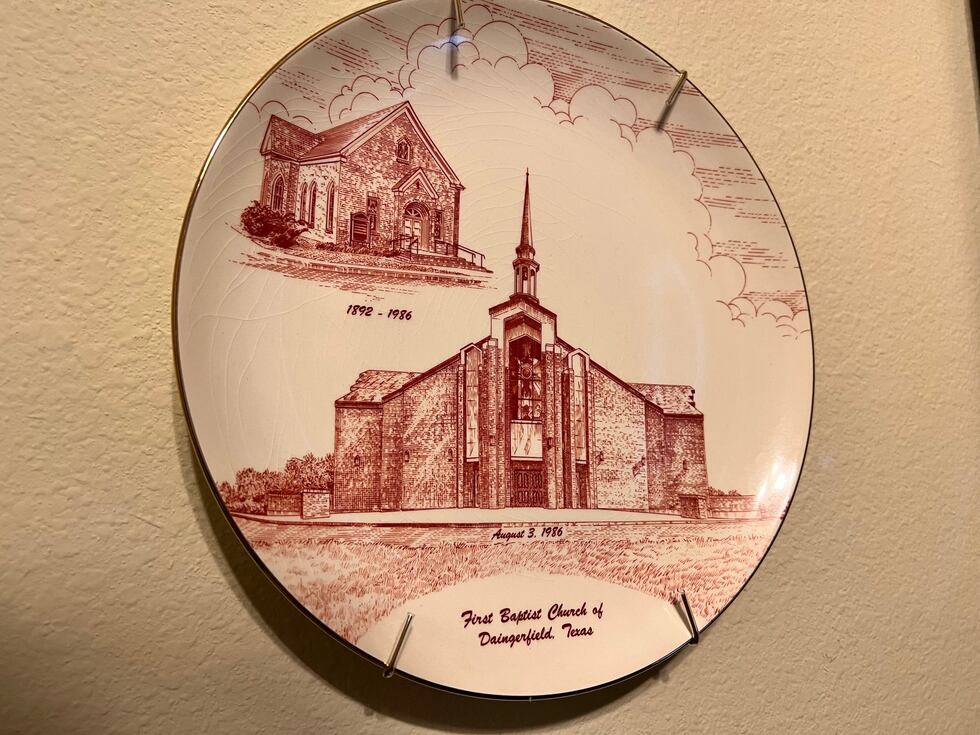 A commemorative plate features the original First Baptist Church of Daingerfield as well as...