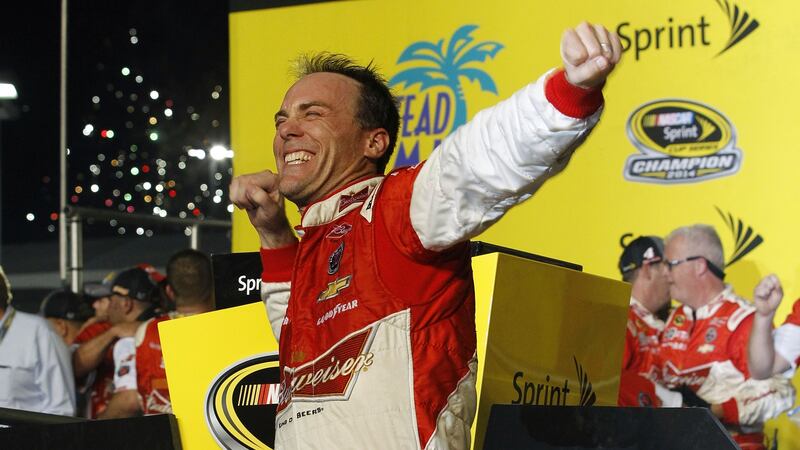 FILE - Kevin Harvick celebrates after winning the NASCAR Sprint Cup championship series auto...