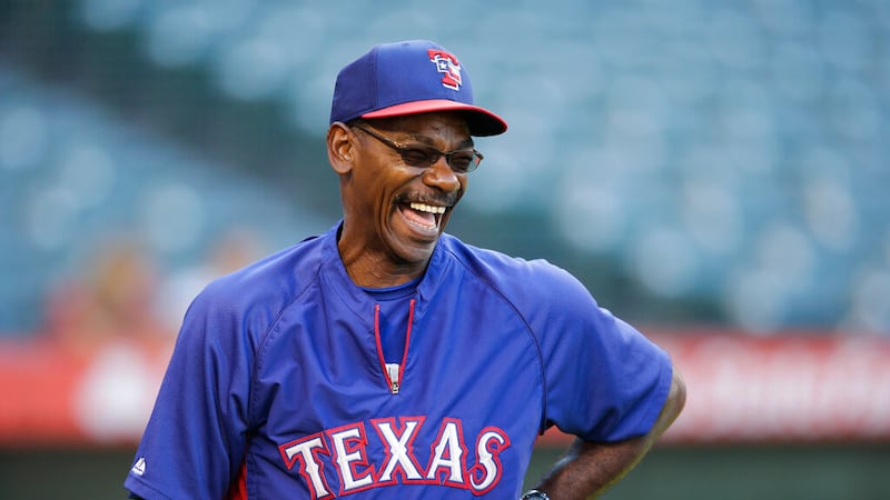 Texas Rangers manager Ron Washington laughs during practice for a baseball game against the...