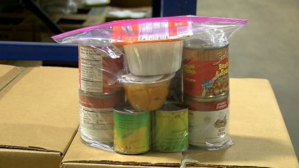 The summer food backpacks are fill with shelf-stable items like peanut butter, granola bars,...