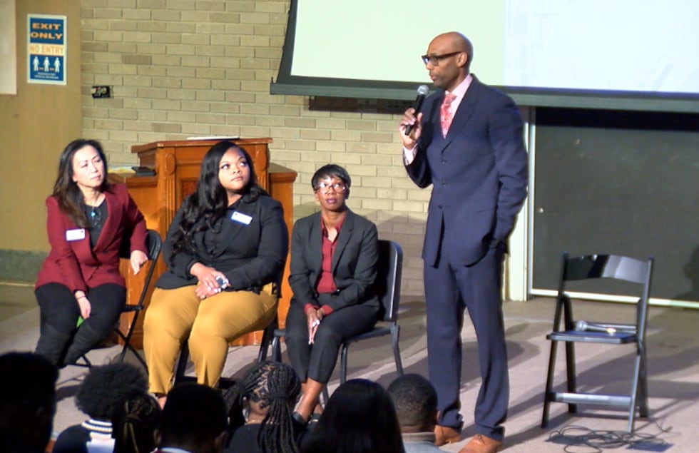 Wells Fargo representatives inform student on proper management of finances.