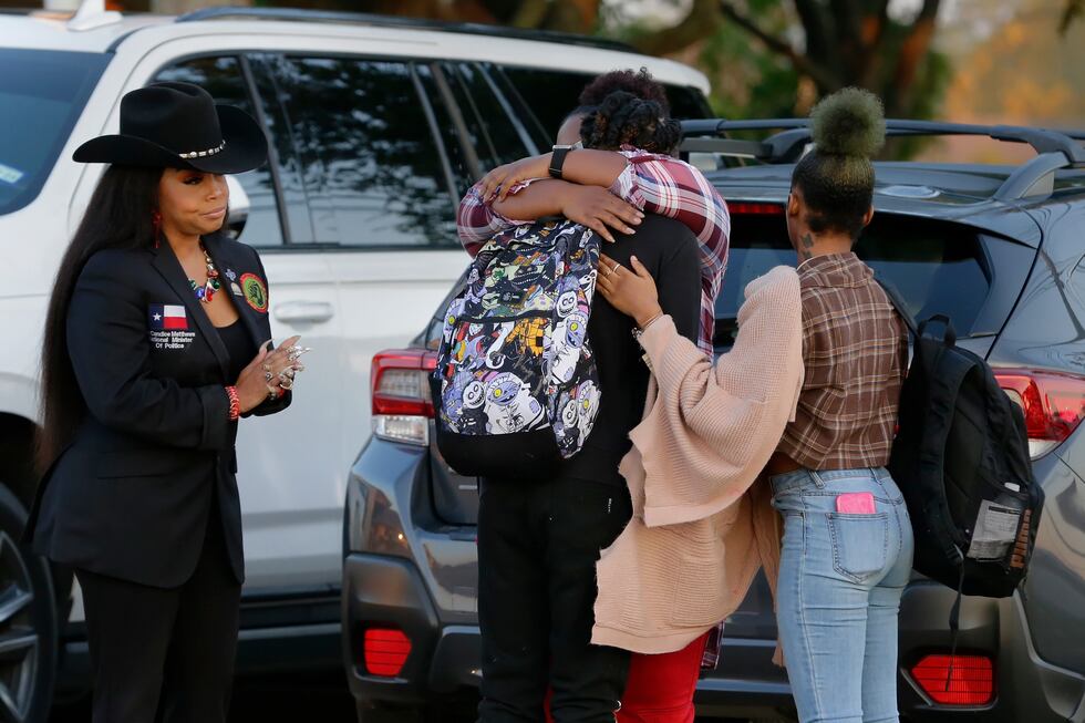 Darryl George, center left, a 17-year-old junior, and his mother Darresha George, center...