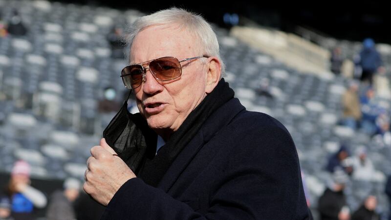 FILE - Dallas Cowboys owner Jerry Jones walks on the field before an NFL football game between...