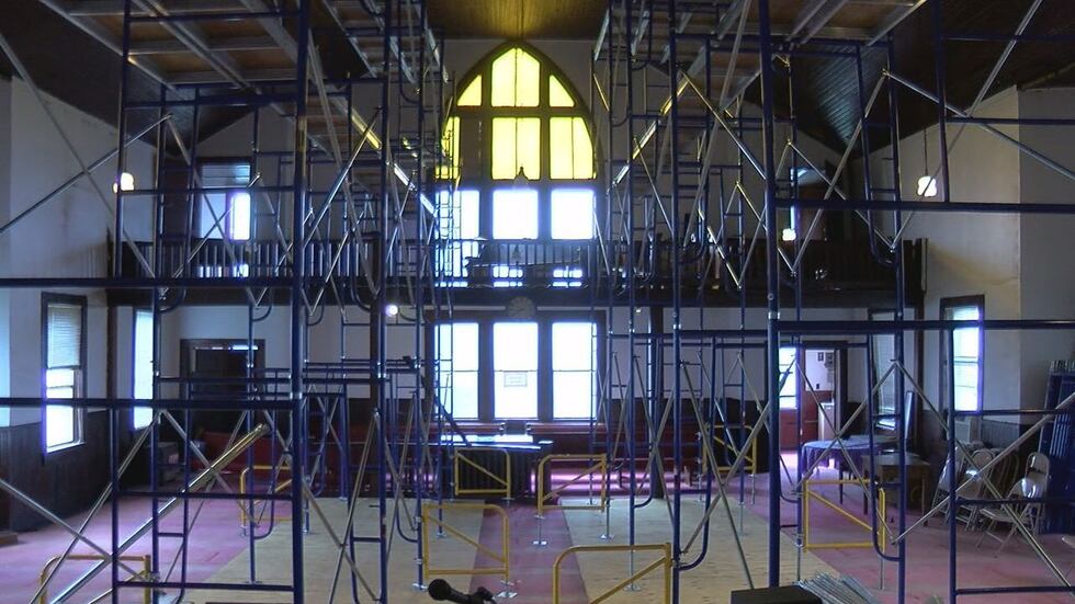 Scaffolding now supports the roof of the sanctuary of 1920s church building. (Source: KLTV staff)