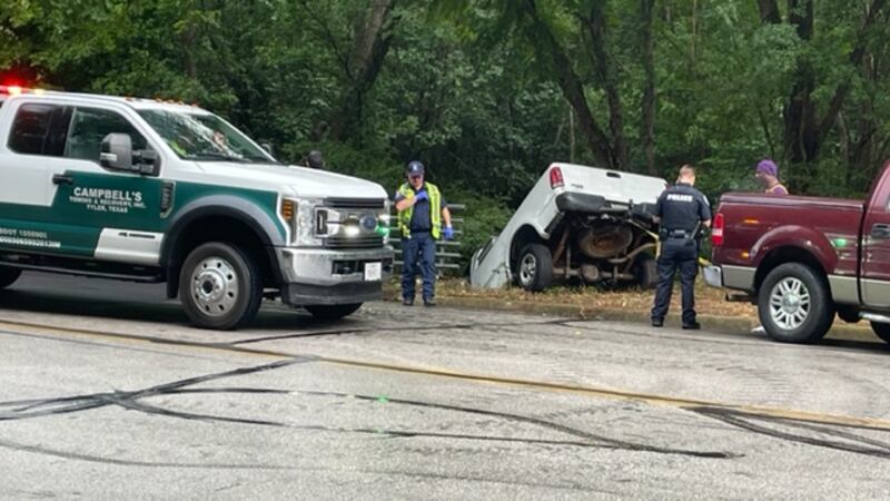 A truck has fallen into a roadside ditch.