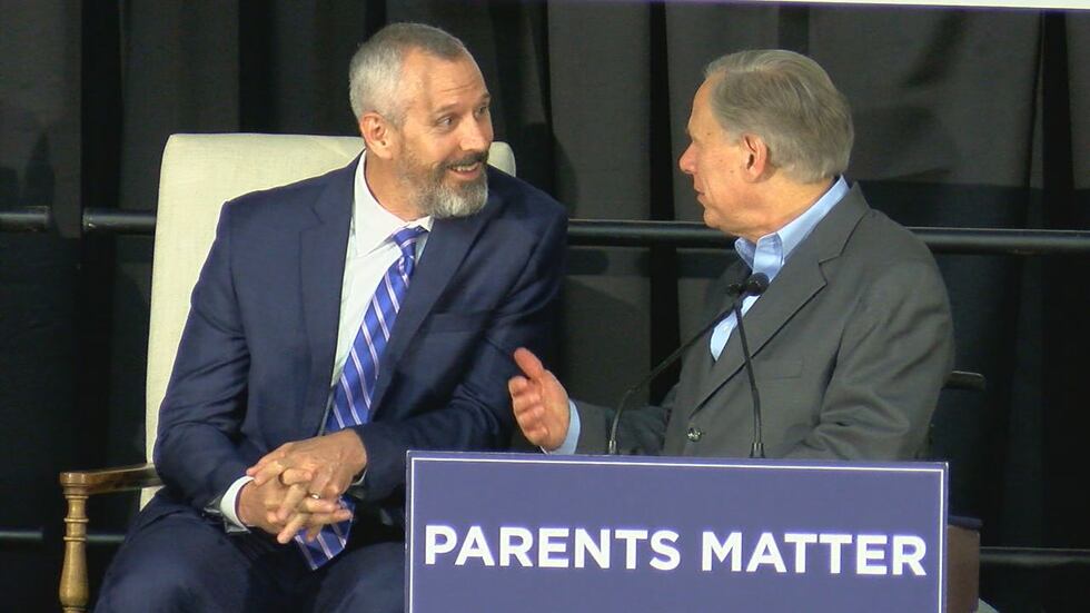 State Rep. Matt Schaefer (R-Tyler) speaks with Gov. Greg Abbott at Thursday night's "Parent...