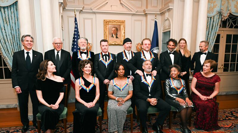 2022 Kennedy Center Honoree George Clooney, bottom third from right, reacts as he is given a...