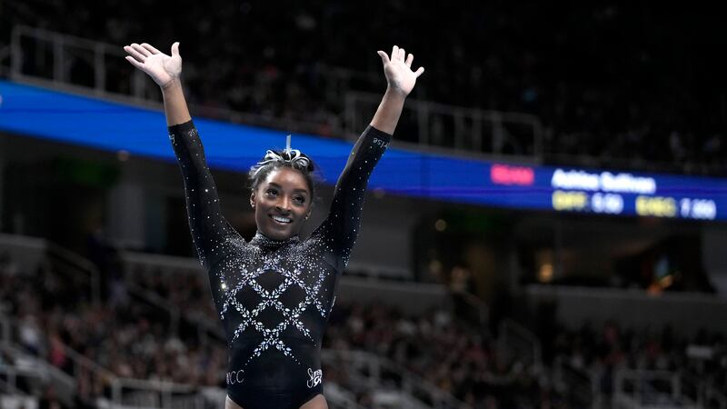 Simone Biles reacts after competing on the floor exercise during the U.S. Gymnastics...