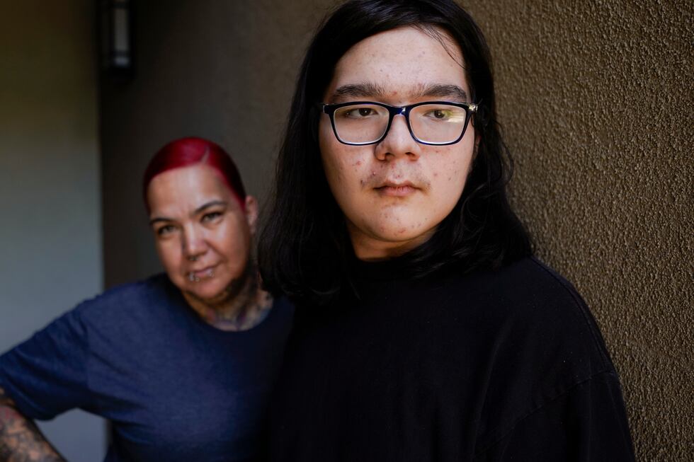Juan Ballina, right, stands with his mother, Carmen Ballina near their home Friday, July 28,...