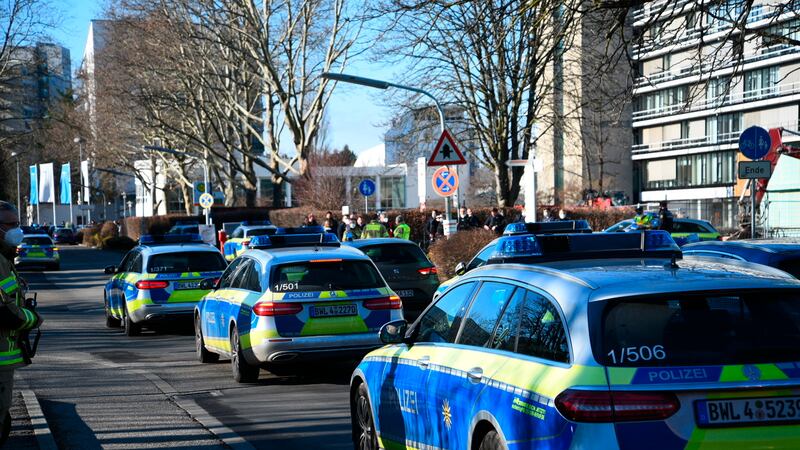 Police vehicles are parked on the grounds of Heidelberg University in Heidelberg, Germany,...