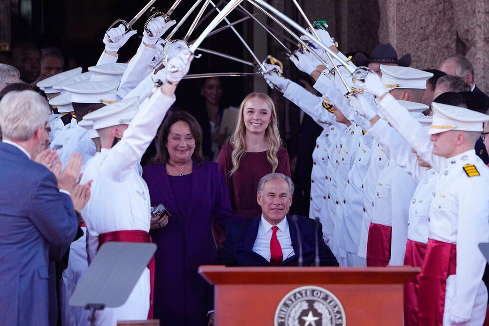 Texas Gov. Greg Abbott, front, arrives for his inauguration ceremony with his wife Cecilia,...