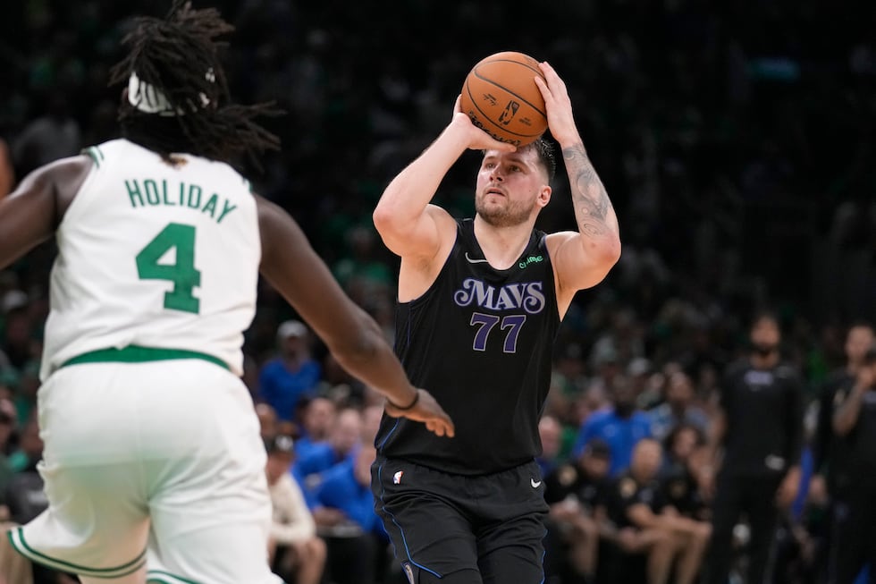 Dallas Mavericks guard Luka Doncic (77) shoots and misses a three-point attempt as Boston...