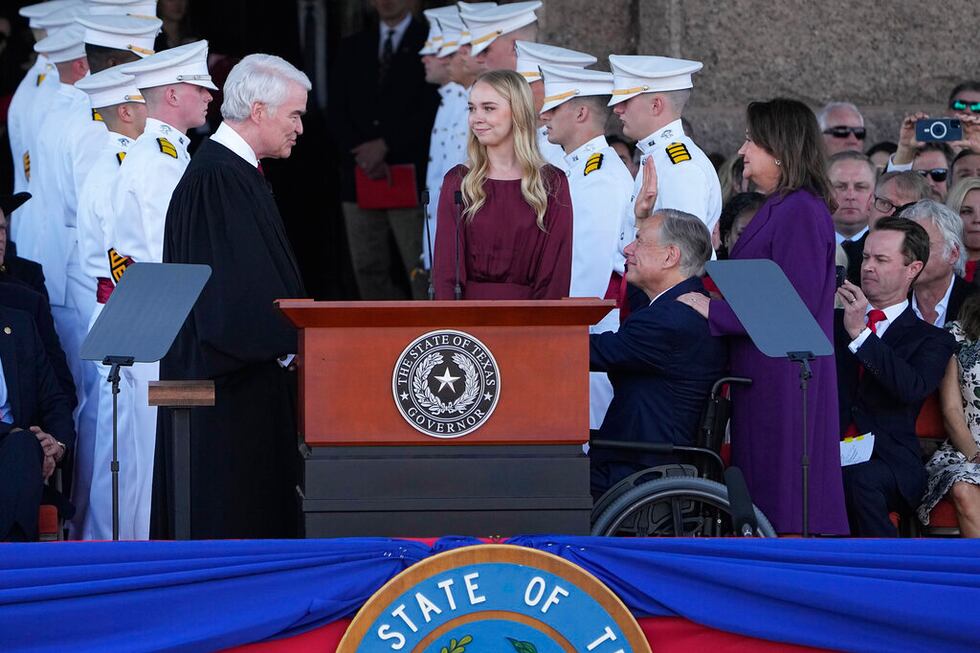 Texas Gov. Greg Abbott, second from right, stands with his wife Cecilia, right, and daughter...
