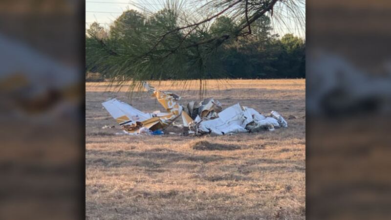 The wreckage of a small plane is visible in a field near the Ponta community in Cherokee...