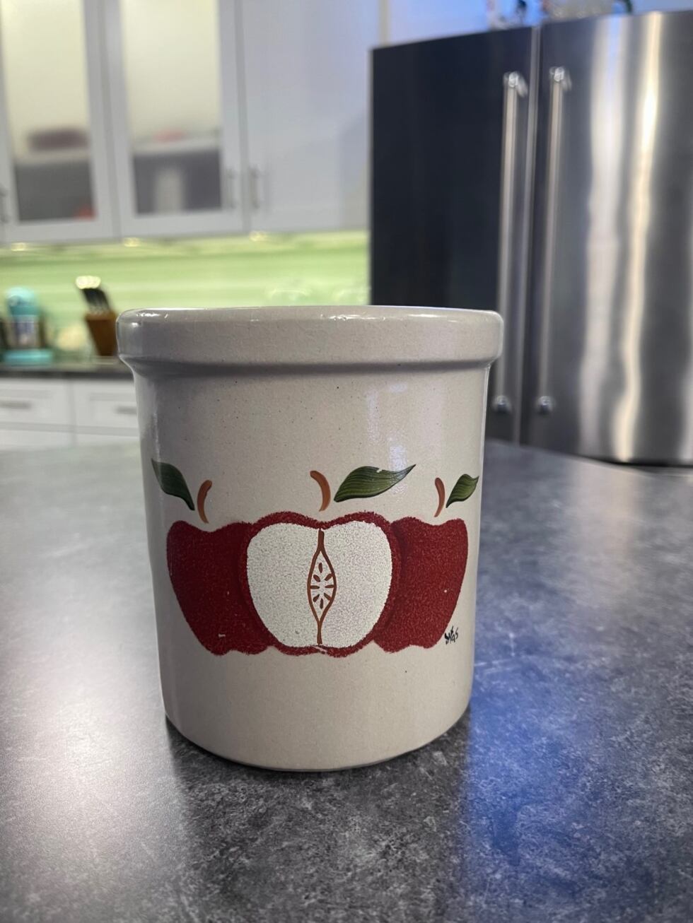 This container is heavy with a nice apple design.