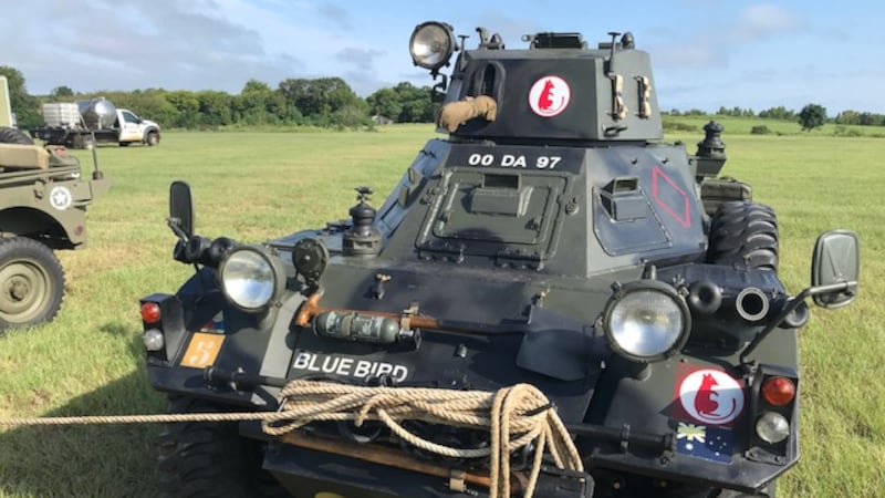 Military vehicles ready for weekend event celebrating veterans.