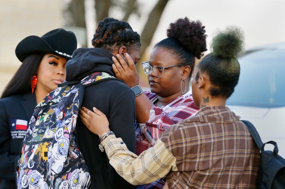 Darryl George, center left, a 17-year-old junior, and his mother Darresha George, center...