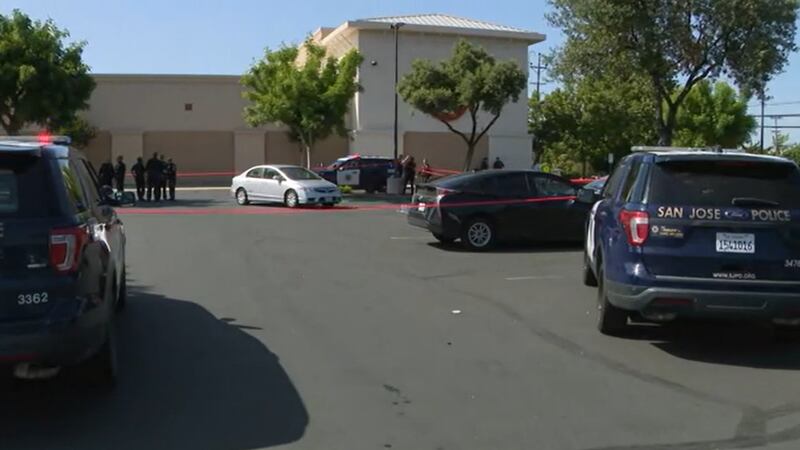 Police are seen in a San Jose shopping center on Thursday.